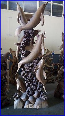 Sculpture de dauphins en bois exotique de 2m50