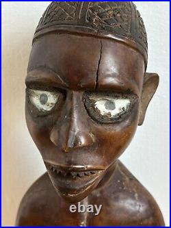 Statue africaine art tribal statue en bois patine brun rouge et cavité Congo